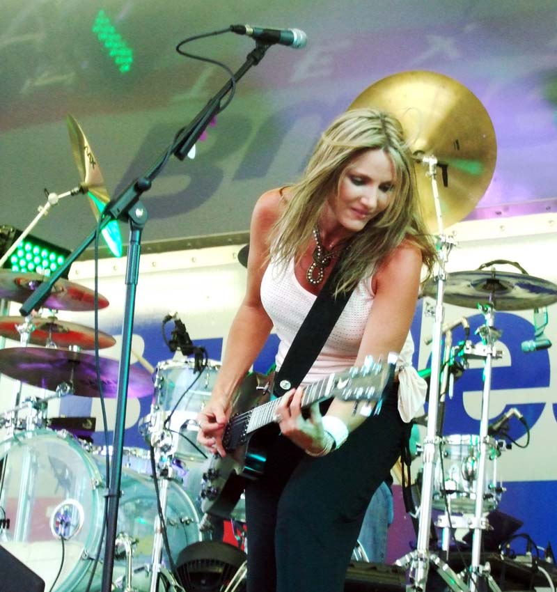 photo of woman playing guitar